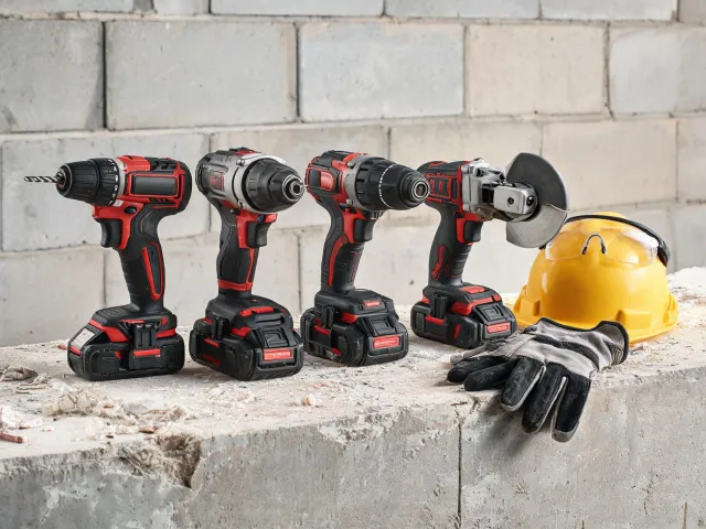 Cordless power tools on a jobsite bench